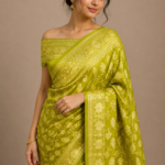 A stunning green silk saree designed to add charm, elegance, and tradition to your style